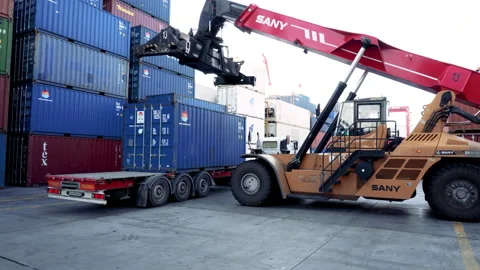 Reachstacker loads a container onto a car  Stock Footage 148597295