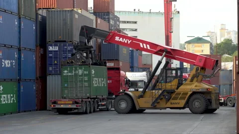 Reachstacker loads a container onto a truck  Stock Footage 149466917