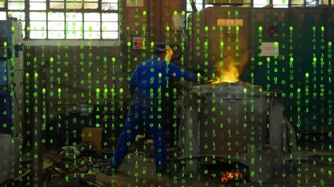 Reacting to sparks, foundry worker blue coveralls leaning, adjusting furnace Stock Footage 331832990