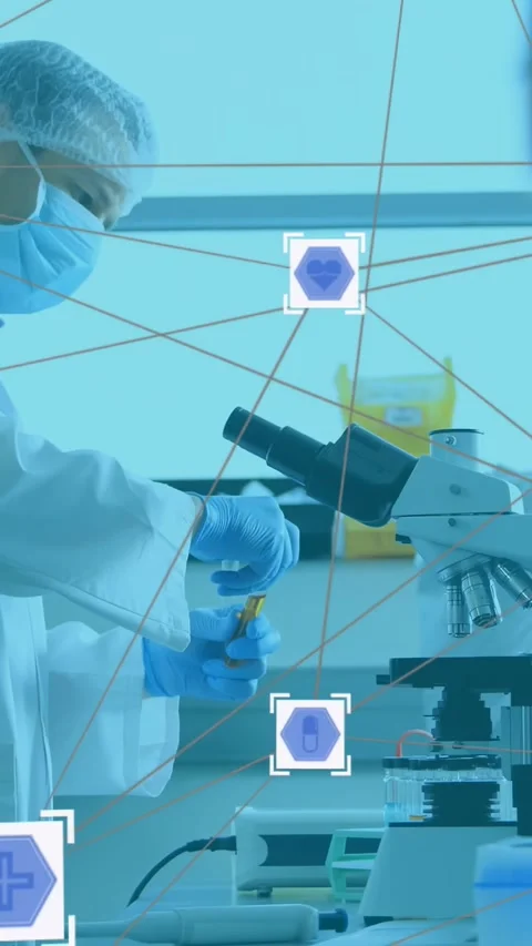 Reacting to UI, lab tech PPE placing yellow vial on microscope focusing for Video stock 330542880