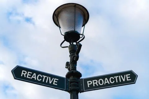 Reactive versus Proactive directional signs on guidepost Stock Photos