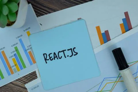 React.JS write on sticky notes isolated on Wooden Table. Foto stock