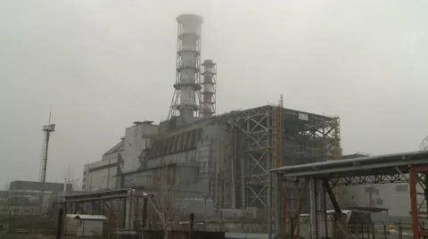 Reactor No. 4 and a protective sarcophagus of the Chernobyl Nuclear power plant. Stock Footage 41971348