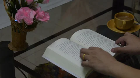 Read a book and drink coffee Stock Footage 39716309