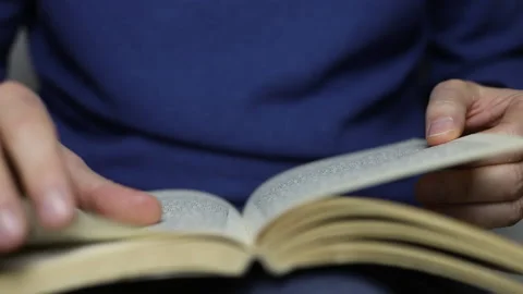Read a book by turning the pages Video stock 144320868