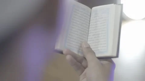 Read the Islamic book of the Koran Stock Footage 212004755