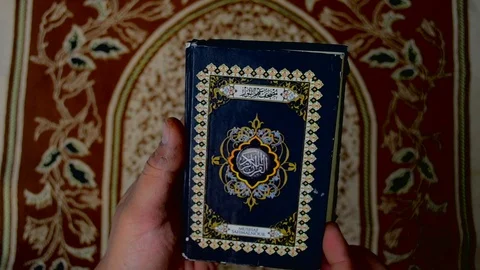 Read litle quran Stock Footage 119736055