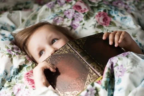 To read lying in a bed Stock Photos