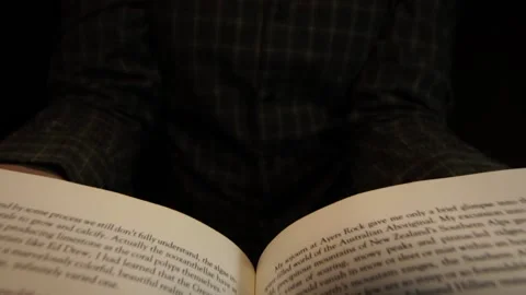 The reader opens the book close-up Stock Footage 132372777