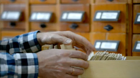 Reader searching in the card index Stock-Footage 42612621