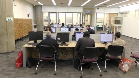 Readers searching computerized archives in the National Library of Israel Video stock 104016833