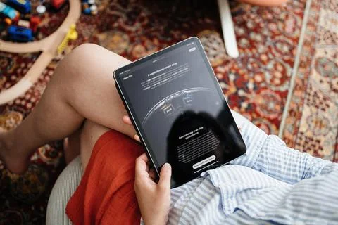 Reading About Apple Vision Pro Spatial Audio on iPad Pro Stock Photos