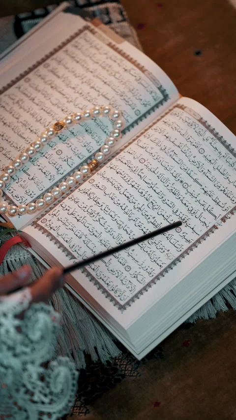 Reading Al Quran close up, vertical Stock Footage 264115358
