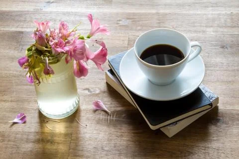 Reading  and drinking coffee Stock Photos