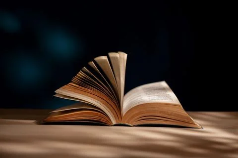 Reading and Education Learning Concept. Opened Book or Bible on Desk Stock Photos