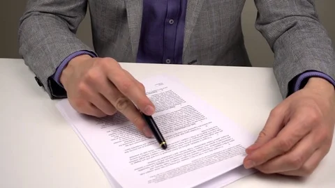 Reading and Signing Contract Stock Footage 73832540