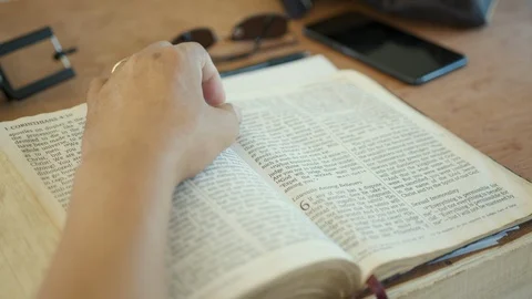 Reading and Studying Bible on Table Stock Footage 128656054