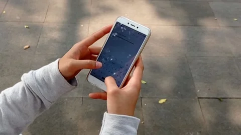 Reading and typing messages on handphone Stock Footage 137023446