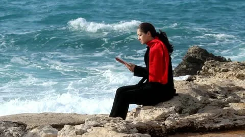 Reading and waves Stock Footage 20646888