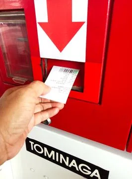 Reading barcode slips using self-powered fuel pump machine scanners at Pert.. Stock Photos