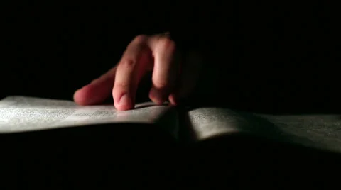 Reading Bible in the Dark Stock Footage 34666670