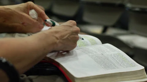 Reading Bible, Taking Notes during Church (devotions) Stock Footage 29665163