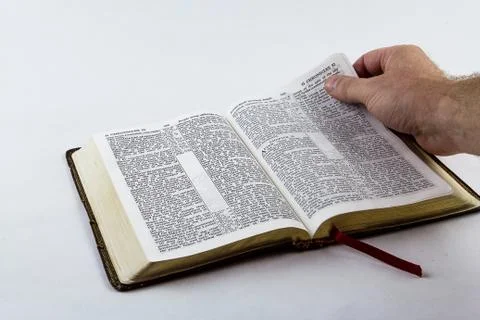 Reading a Bible on White Background Stock Photos