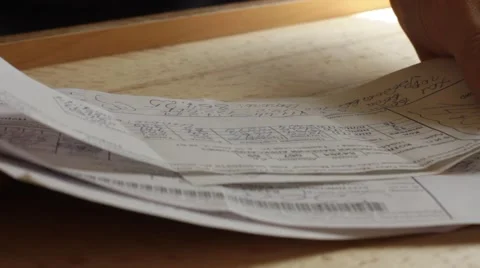 Reading bills with expenses Stock Footage 59764148