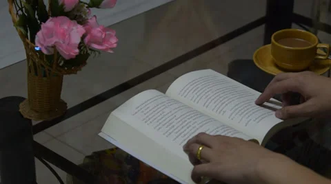 Reading book and drink coffee Stock Footage 39716573