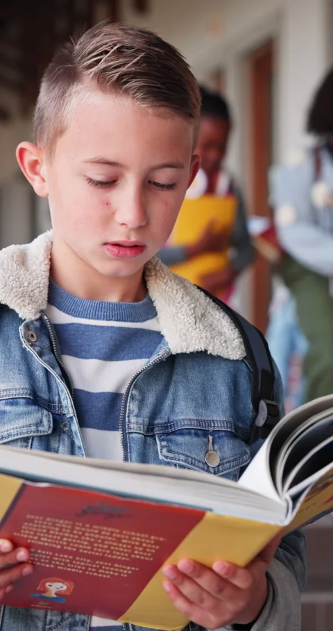 Reading, book and future with child in school hallway for education, knowledge Stockbeeldmateriaal 341079347