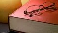 reading: book and glasses under lamp HD Footage