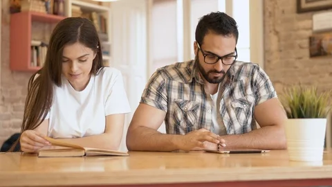 Reading with Book and Tablet Видео 91829913