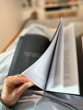 Reading a book in bed Stock Photos