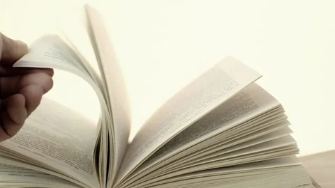 Reading book concept. The hand is leafing through the book. Book pages Stock Footage 151170588