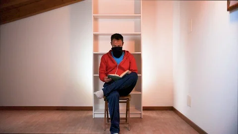 Reading book in a empty room - Theater performance Stock Footage 129039388