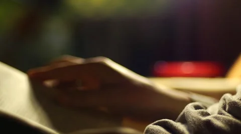 Reading a book in the evening Video stock 45585638