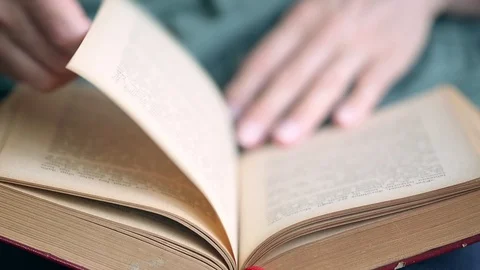 Reading a book Video stock 92538907