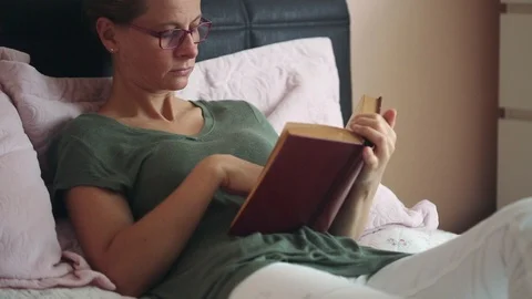 Reading a book Video stock 92542754