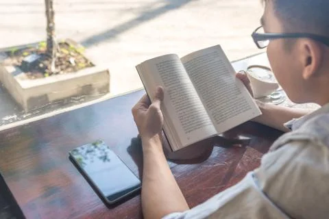 Reading book is good way to improve useful knowledge Stock Photos