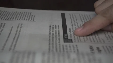 Reading a book line by line studying panning shot Stock Footage 112655708