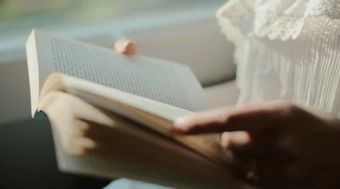 Reading book in a moving train Stock Footage