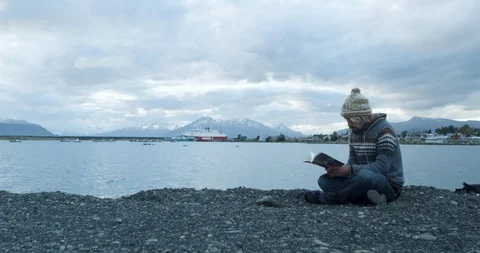 Reading a book in nature Stock Footage 90076205