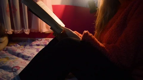 Reading a book at night. Stock Footage 104763888
