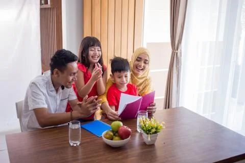 Reading a book with parent Stock Photos