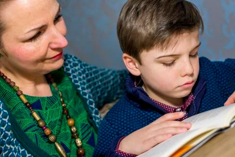 Reading book together Stock Photos