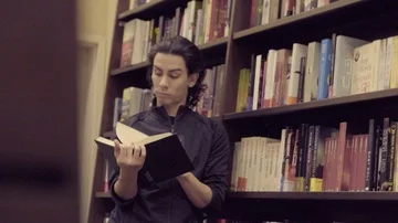 READING IN A BOOKSTORE Stock Footage 86082274