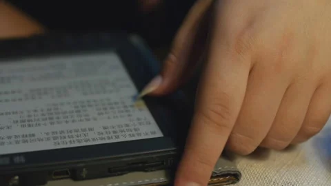 Reading a Chinese e-book under the lights Stock-Footage 162979410