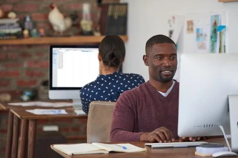 Reading, computer and man with web design in office, site optimization and .. Stockfoto's