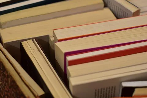 Reading concept: stack of old books with paper turned up Stock Photos