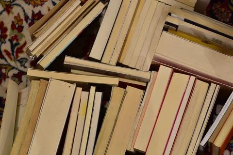 Reading concept: stack of old books with paper turned up 库存照片